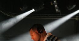 DJ The unmistakable of a DJ scratching a record fills the room, captivating the crowd with its rhythmic intensity. The