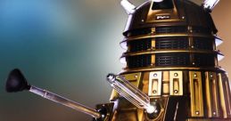 Golden Dalek with iconic shape, protruding eye stalk, and plungers, representing classic sci-fi villain from Doctor Who.