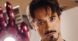 Tony Stark, portrayed by Robert Downey Jr., showcases his iconic Iron Man suit and glowing arc reactor.