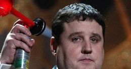 Peter Kay performing on stage, humorously holding a horn and microphone, showcases his comedic style and charisma.