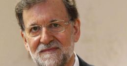 Mariano Rajoy looking confident in a formal suit, highlighting his role in Spanish politics and leadership.