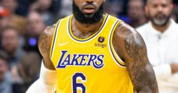 LeBron James in Lakers uniform, poised with a basketball, showcasing his skills on the court during an NBA game.