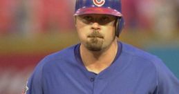 Coomer in a blue Chicago Cubs uniform, focused expression, running on the field during a baseball game.