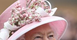 Queen Elizabeth smiling, wearing a pink hat adorned with flowers, showcasing her signature style and elegance.