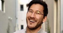 Markiplier smiling in casual attire, enjoying the outdoors. Playful expression captures his engaging personality.