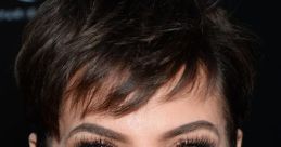 Kris Jenner showcases her signature look with short hair and elegant makeup, exuding confidence at a glamorous event.