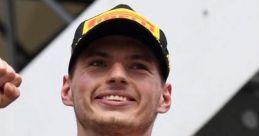 Max Verstappen celebrating victory in Red Bull Racing uniform, showcasing his winning smile and fist pump. F1 champion moment.