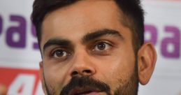 Virat Kohli speaking passionately at a press conference, showcasing his leadership and charisma in cricket.