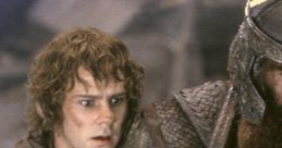 Frodo Baggins looks concerned while holding a weapon beside a heavily armored warrior in "The Lord of the Rings.