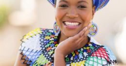 Smiling woman in vibrant attire highlighting Jamaican Patois words influenced by African heritage and culture.