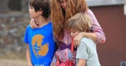 Mother and two children enjoying a carefree moment outdoors, reflecting family love and connection in a relaxed setting.