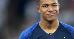 Kylian Mbappé proudly holding his trophy, celebrating his achievements in international football.