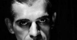 Boris Karloff in classic black and white portrait, exuding a mysterious and captivating presence. Iconic horror actor.