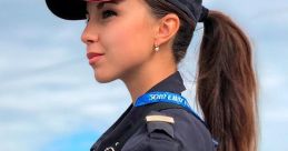 Дарина Юсупова in police uniform, showcasing her role with authority and poise against a sky backdrop.