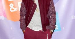 Nasir Jones sporting a stylish outfit at an event, showcasing streetwear fashion trends and urban style.