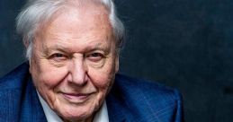 Portrait of Sir David Attenborough, showcasing his wise expression and signature style in a blue jacket against a dark background.