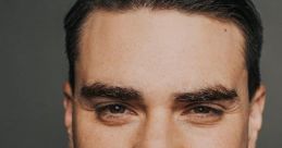 Ben Shapiro confidently smiles, showcasing his intellectual charisma and distinctive style in a professional portrait.