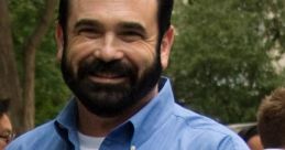 Billy Mays giving a thumbs up, wearing an OxiClean shirt, showcasing his signature charm and enthusiasm for cleaning products.