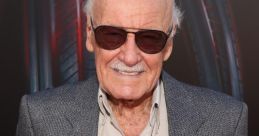 Stan Lee smiles in sunglasses at a comic event, embodying his legacy as a legendary comic book creator and cultural icon.