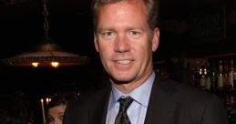 Chris Hansen in a stylish suit at an upscale event, showcasing his charismatic presence and television personality.