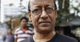 Pratim Bhayade in a black t-shirt featuring the logo of Nu-Age Mime Theatre, outdoors with a blurred background.