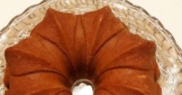 Delicious Domca Babovka on a decorative dish, showcasing its unique bundt shape and golden-brown color. Perfect dessert idea.