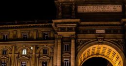 Nighttime scene of Florence, Italy, showcasing historic architecture and a vibrant carousel in the square.