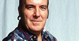 Chiquito de la Calzada in a colorful plaid and polka dot shirt, showcasing his signature comedic style and charisma.