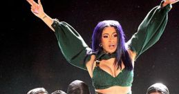 Cardi B performs "Up" with dancers on stage, showcasing dynamic choreography and powerful stage presence.