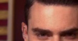 Close-up of Ben Shapiro, notable conservative commentator, discussing political issues with a focused expression.