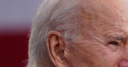 Close-up profile of Joe Biden, 46th U.S. President, displaying a serious expression during a public appearance.