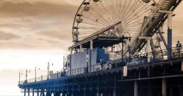 Ferris wheel at sunset reflects in shallow water, capturing the serene beauty of a seaside pier, evoking feelings of tranquility.