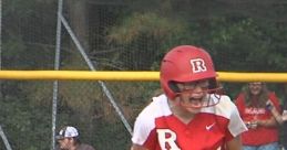 Excited Rustburg Softball player celebrating a big play, showcasing team spirit and determination on the field.