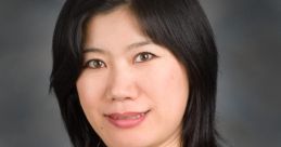 Professional portrait of Tjin Li Wang, showcasing her formal attire and confident expression against a neutral backdrop.