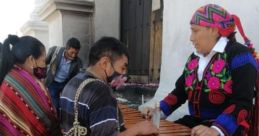 Traditional Maya musicians demonstrating craftsmanship on a marimba, showcasing cultural heritage and vibrant attire.