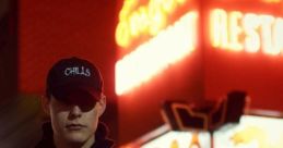 Person wearing a "Chills" hoodie and cap stands in front of a vibrant neon restaurant sign at night, exuding a mysterious vibe.