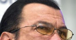 Close-up of Steven Seagal, showcasing his signature sunglasses and intense expression, reflecting his iconic action star persona.