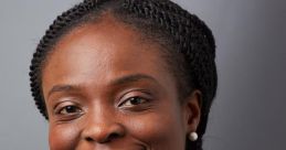 Professional headshot of Oluwatosin Fatunbi, featuring a smiling woman with braided hair, wearing a blue top and black blazer.