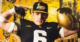 Iowa football player showcasing jersey number 6, posing with a helmet and football against a vibrant Hawkeyes backdrop.