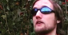 Person wearing sunglasses and an "Ace Gamer" shirt, outdoors, promoting gaming culture and Zeb 89.