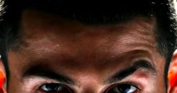 Intense close-up of a focused athlete showcasing determination and strength, with striking features and piercing eyes.