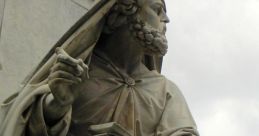 Marble statue of a bearded figure in robes, symbolizing wisdom and prophecy, reminiscent of the biblical Isaiah.