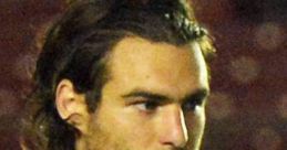 Profile of Zusi in a US soccer jersey, focused expression, showing dedication and passion for the game.