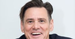 Jim Carrey smiling broadly in stylish attire, showcasing his charismatic personality and comedic charm.