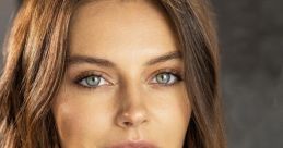 Close-up of Kasey Hanbury with stunning blue eyes and natural makeup against a neutral background. Captivating portrait.