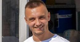 Smiling young man in a white T-shirt with APB logo, standing outdoors. Perfect for showcasing Bastien Cerqueira's energy.