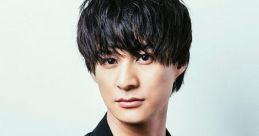 Stylish portrait of 富田翔太 with tousled hair and a black outfit, exuding a charismatic and confident aura.