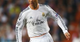 Cristiano Ronaldo in action for Real Madrid during a Champions League match, showcasing his soccer skills and athleticism.