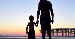 Father and son holding hands on a beach at sunset, reflecting a joyful family bond and summer memories.