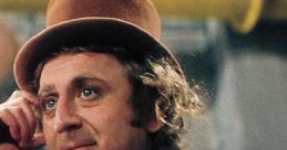 Gene Wilder as Willy Wonka, wearing a brown top hat and floral attire, exudes charisma and whimsy in the chocolate factory.